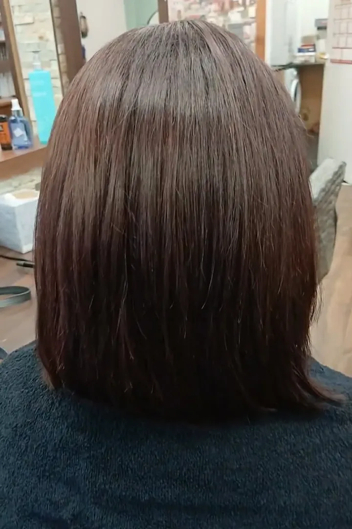dark red hair of a woman at a hair salon