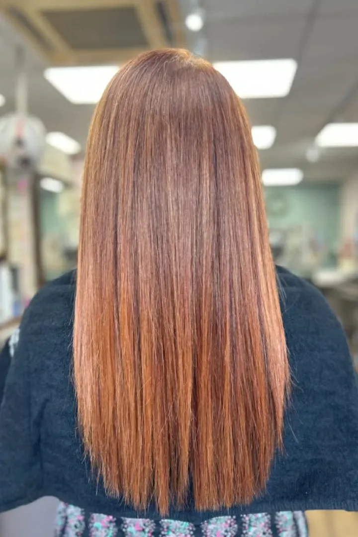 ginger hair of a woman at a salon from the back